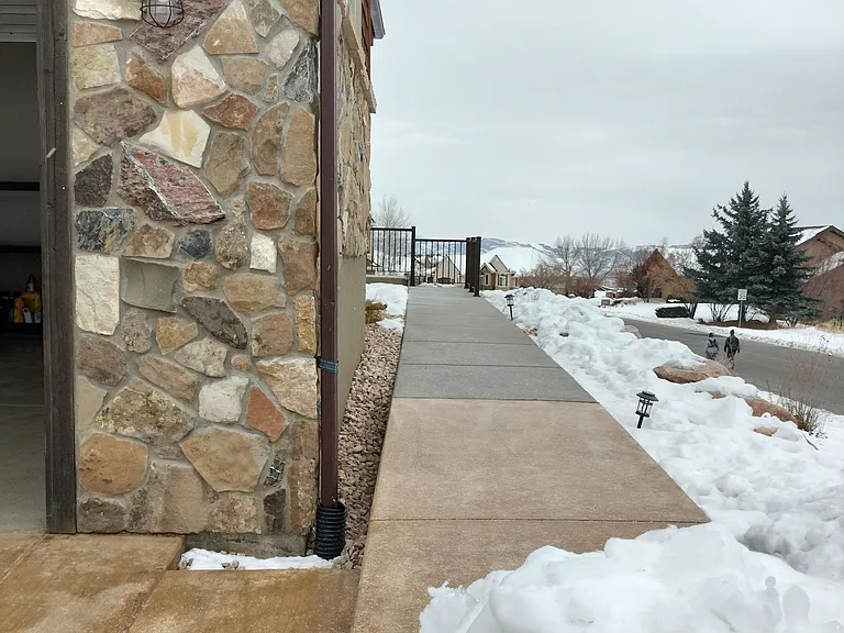 Spacious living room in a beautiful open-floor-plan home. Enjoy unobstructed mountain views, vibrant wildlife from your couch, and peace of mind with security cameras. Zero-scape yard ensures low maintenance and natural beauty year-round.