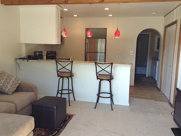 View from front sliding doors. Living room and kitchen.