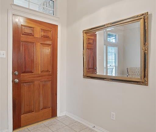 Tiled entry way that opens up to the formal living and dining area