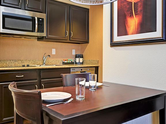 Kitchen - full size refrigerator, microwave, two burner stove top, dishwasher. Includes dishware, coffee maker, pots and pans.