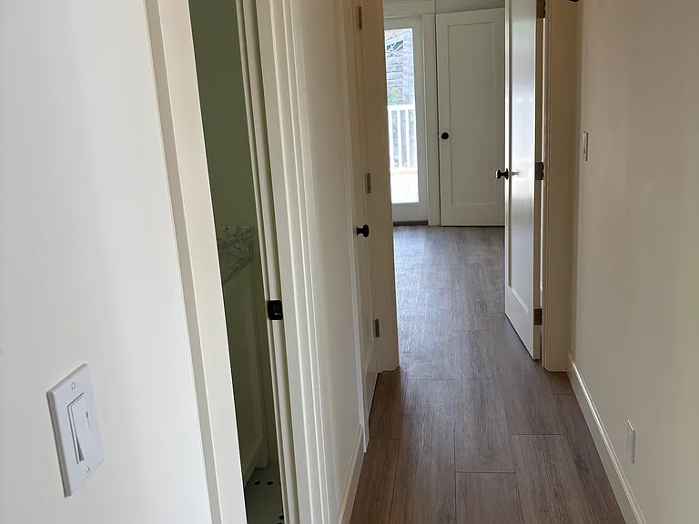Luxury Vinyl Plank, custom paint colors and craftsman sconce lighting.