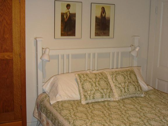 Queen-size bed, wardrobe, and dresser in the bedroom (walk-i