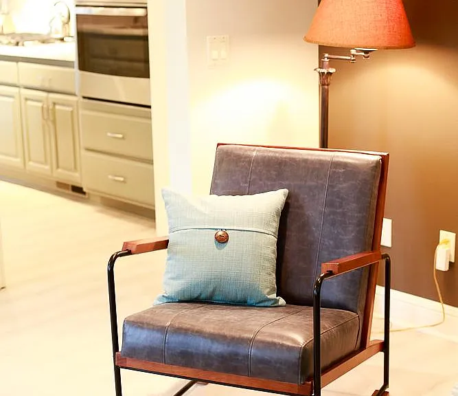 Comfy and tasteful seating options. Warm accent colors.