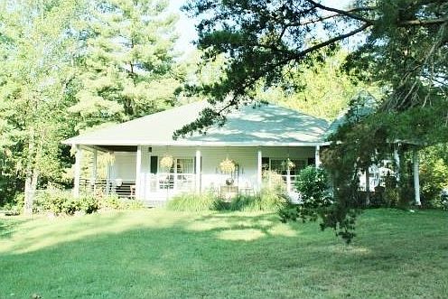 Side of home showing the wrap around porch.