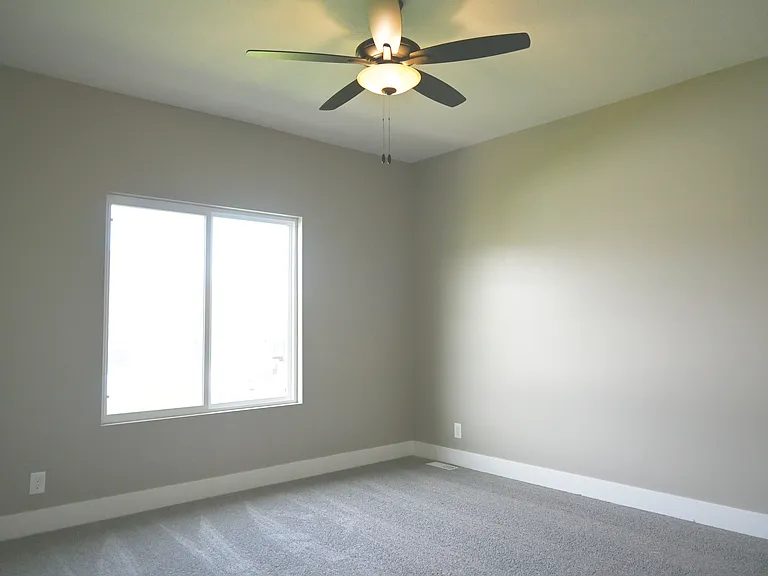 Large window in modern bedroom.