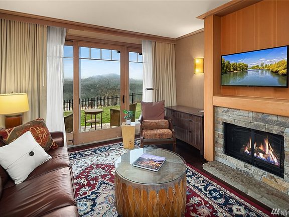 Enjoy this "Rare" Ground-Level Condo while Gazing at the Gorgeous Mountain and River Views below. 