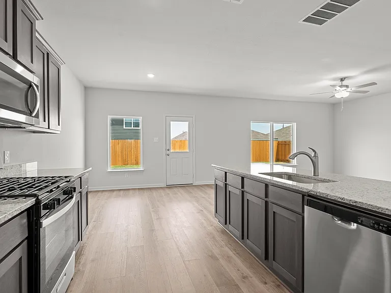 The kitchen has sprawling granite countertops.