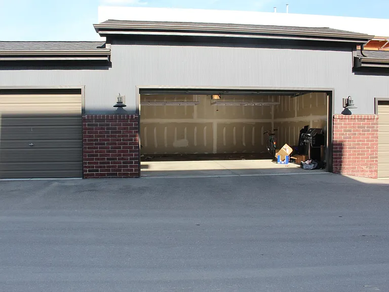 2 car garage with ceiling storage racks