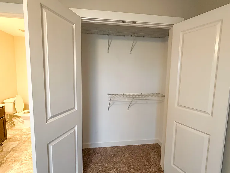 The bedroom features a large double door closet.