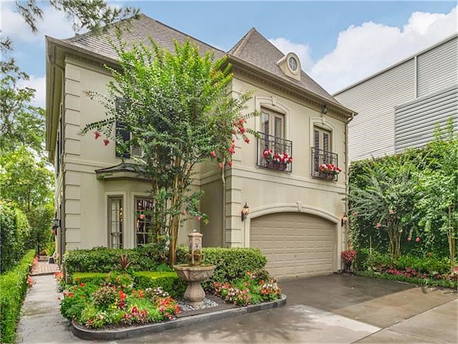 Lush landscaping surrounds this patio style home amongst multi-million dollar opportunities.