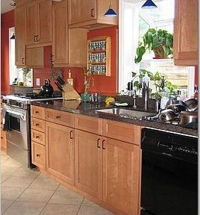 Updated kitchen with granite slab counter tops, stainless st