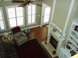 2stry family rm w/ custom cabinetry & hardwood floors