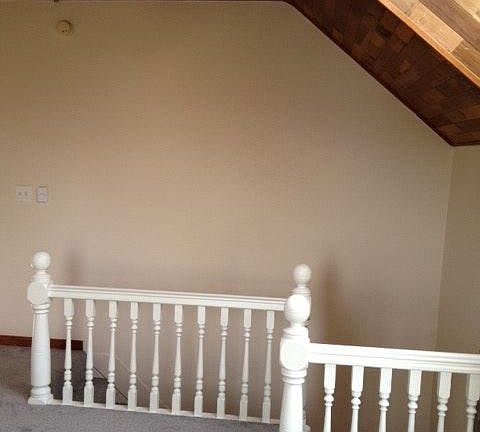 Original 1904 staircase railing South facing view of living room