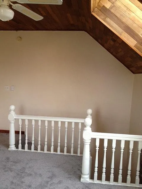 Original 1904 staircase railing South facing view of living room