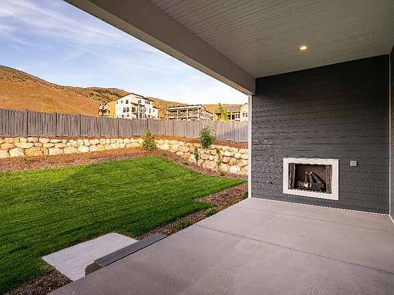 Stewart Craftsman Covered Patio with a Fireplace