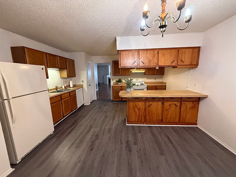 Kitchen with Island, cabinets and appliances. Refrigerator,stove and dishwasher