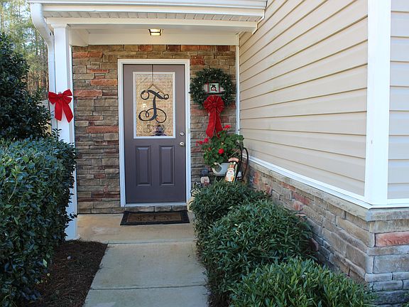 Upgraded stone front door surround, entry wall and front of