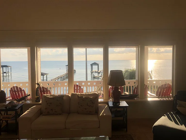 View of the bay from the kitchen sink. **Please note that the effects of several recent hurricanes unfortunately destroyed the pier in the background and it is currently unusable.**