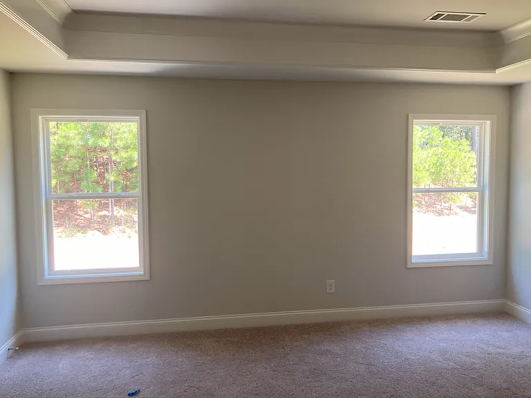 Master bedroom with double windows