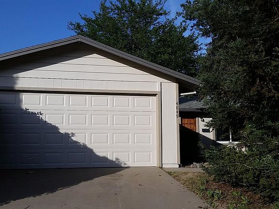 Front of the house with two car garage and drive way. RV access on the left, not shown on the picture.