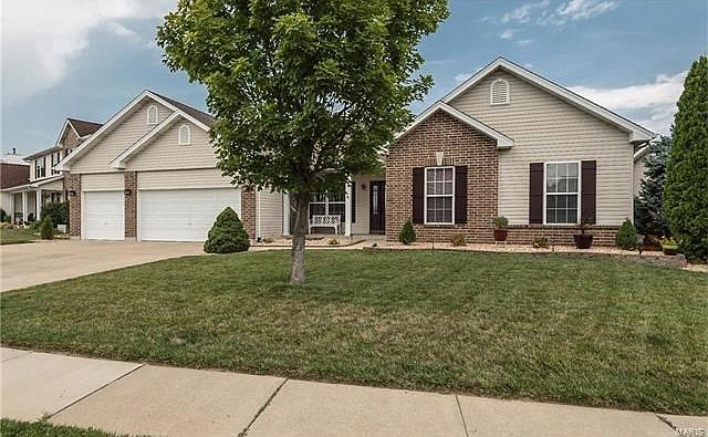 Welcome to 3328 Carriage Crossing in sought after Stable Ridge Estates in the Orchard Farm School District!