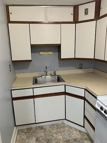 Beige Kitchen Cabinets and New Flooring