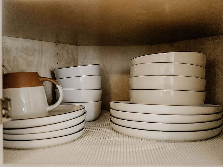 Enjoy hassle-free meals with a fully stocked kitchen, complete with plenty of dishes, cups, and bowls for your convenience