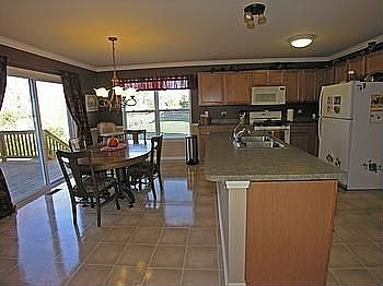Large Island Kitchen with Maple Cabinets