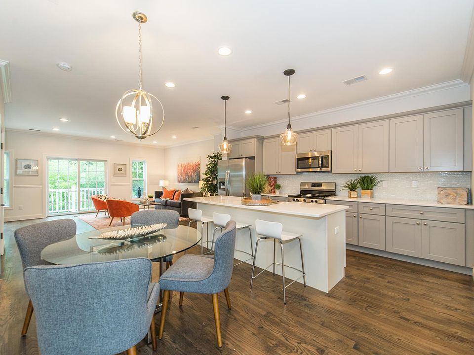 Stunning Eat-in kitchen. Center island, pantry, stainless appliances, quartz countertops, tons of cabinets & counter space