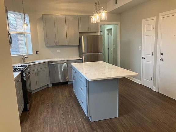 Looking into kitchen from common area. Island will seat 5 adults.