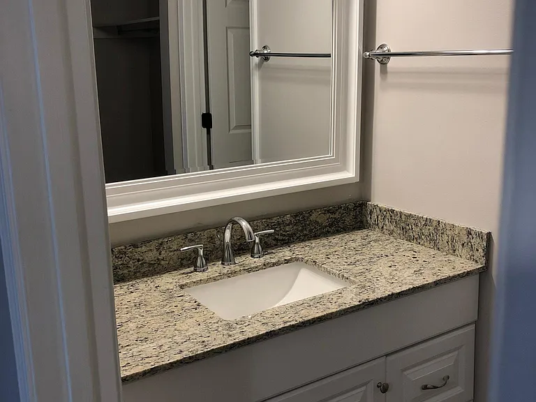 Attached bathroom to main bedroom - granite countertop