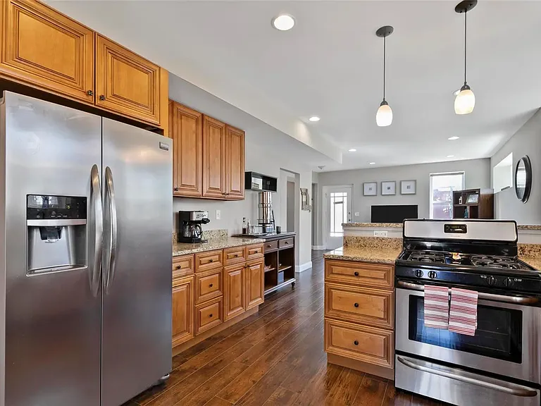 Stainless Steel appliances + Eat in kitchen bar