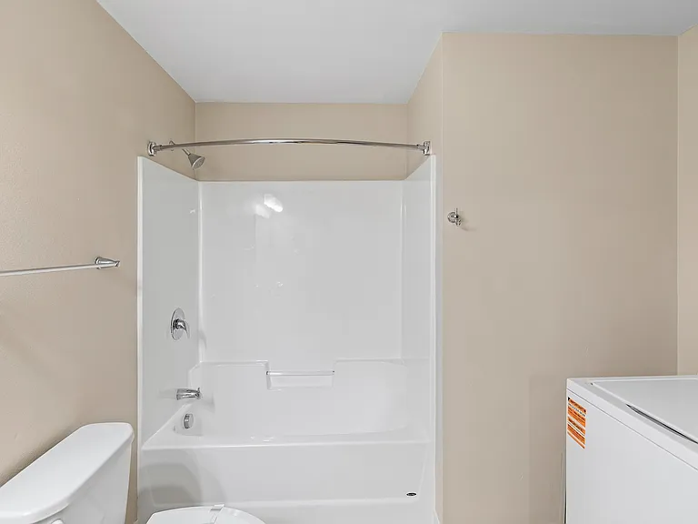 Step into comfort at Overlook Ridge with this modern bathroom featuring sleek fixtures and a spacious layout. Enjoy the stylish design and functionality that elevates everyday living. Schedule a tour today to see it in person!