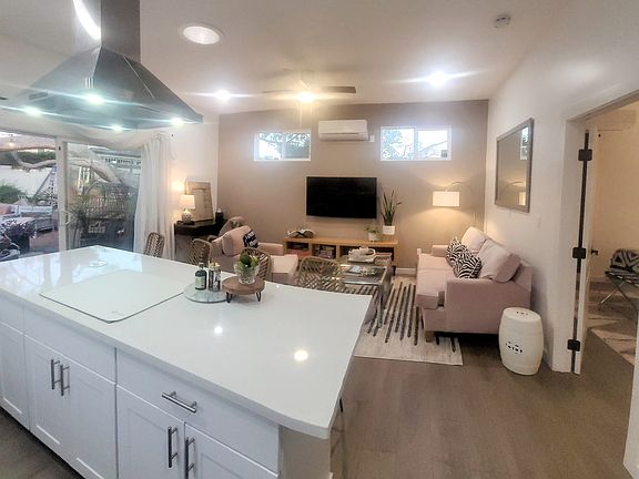 Open floorpan kitchen & living room with dedicated desk work station.