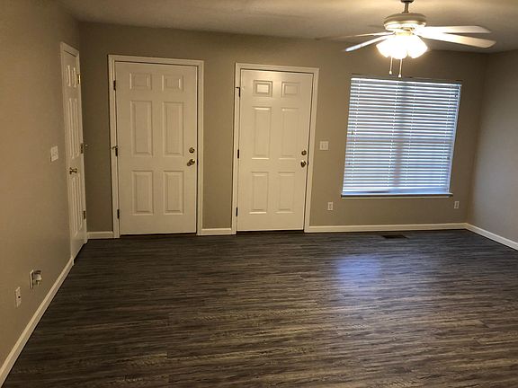 Living room with coat closet and access to garage.