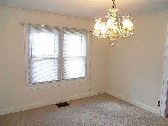 Dining Room. Large dining room with fresh paint and new carpet.
