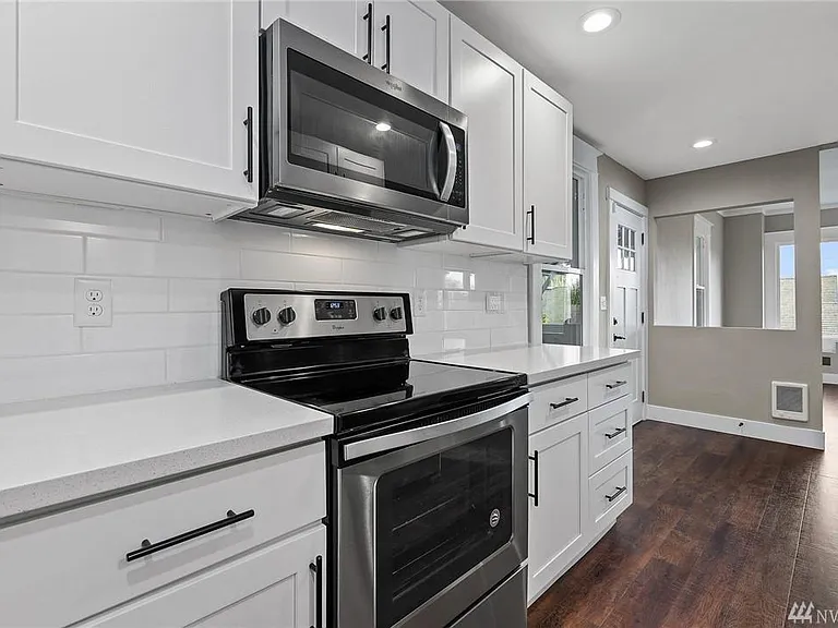 Designed for both style and function, the kitchen offers generous workspace, abundant storage, and an open connection to the main living areas.
