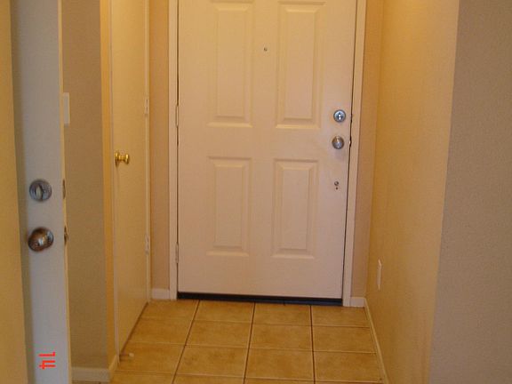 Tiled Front Entry & Garage Entry Door on Left