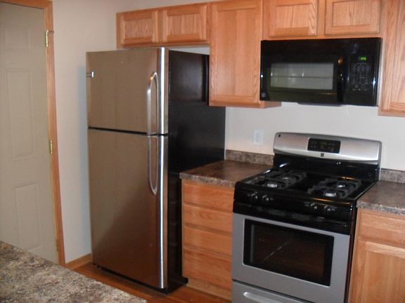 Kitchen with stainless steel appliances including gas range.