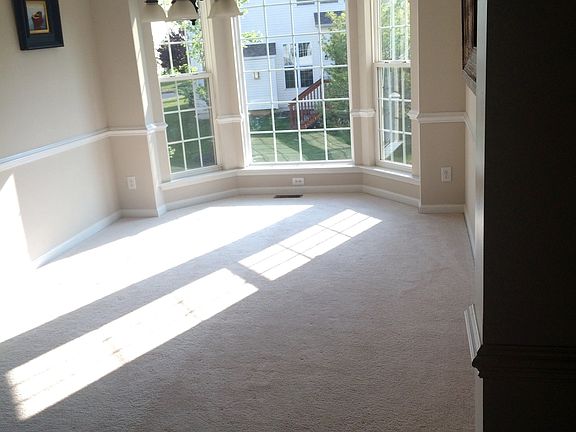 Formal dining room with large bay window