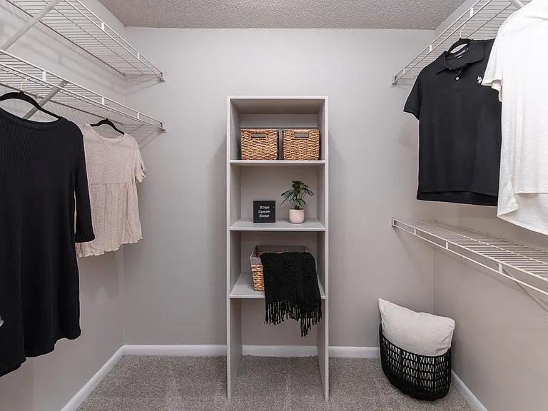 Maximize your storage potential with our thoughtfully designed walk-in closets, complete with built-in shelving.