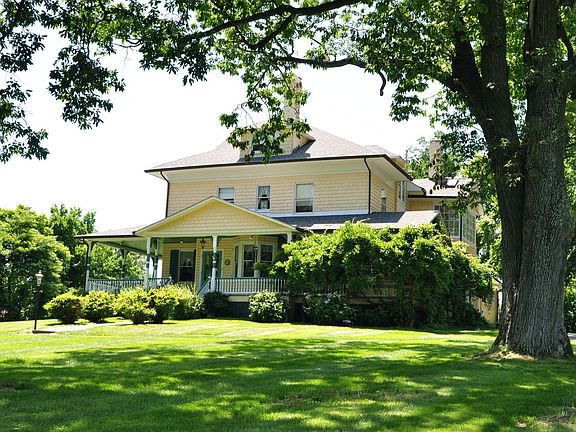 House Shaded by Chestnut Oaks