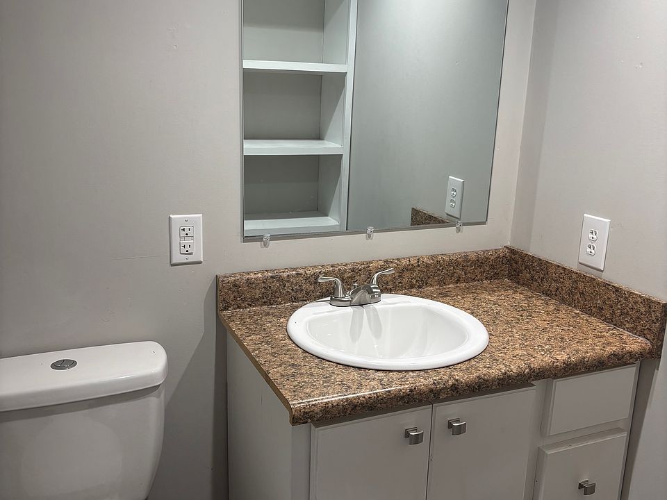 Primary bathroom off main bedroom_. solid wood cabinetry. Not mobile home cabinetry.