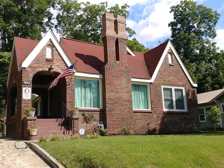 Lovely home displaying old glory. This gem has a lot of character. Everything from the double stacked chimney, to the large living room windows, and the high pitched roof.