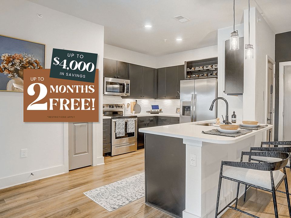 Kitchen with Quartz Countertop and Stainless Steel Appliances.