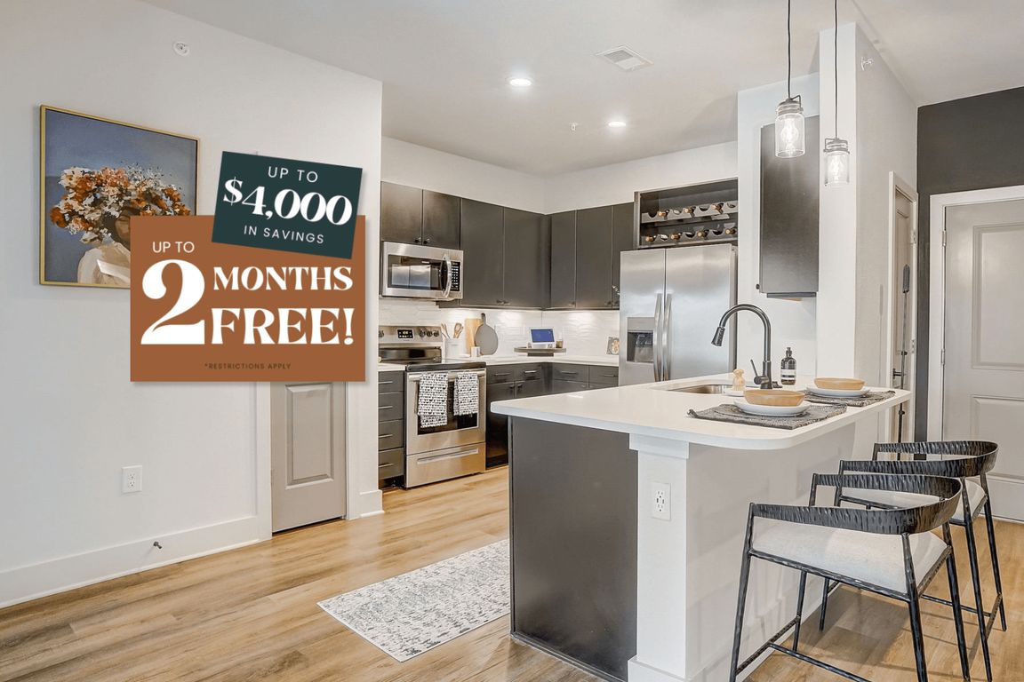 Kitchen with Quartz Countertop and Stainless Steel Appliances.