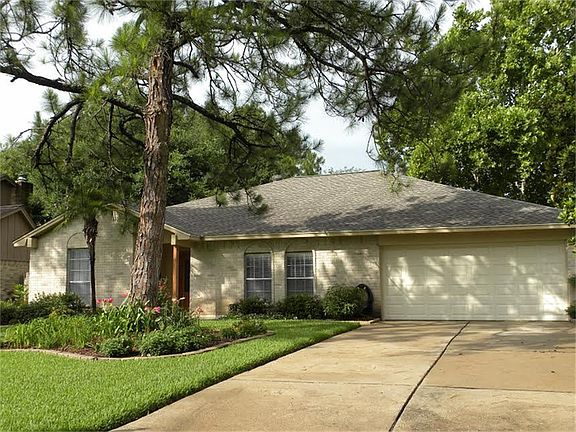 Beautiful trees and landscaping surround your home.