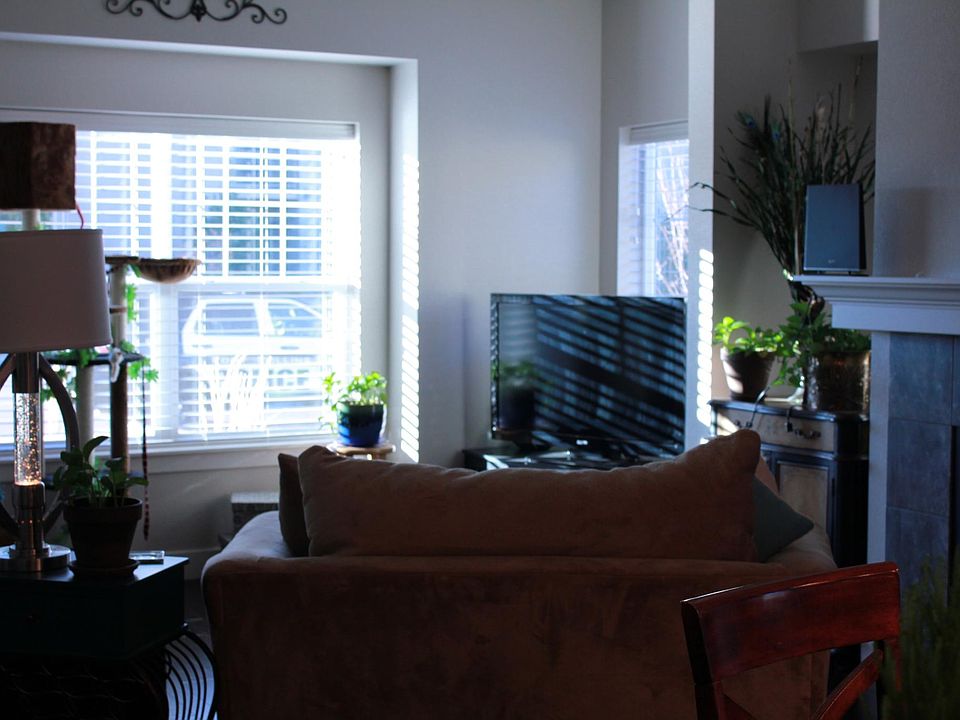 Bright, open living room with gas fireplace