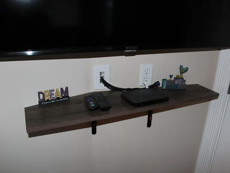 Shelf under Roku Smart TV (Note: Cable for HDMI @ input for Firestick input connection)