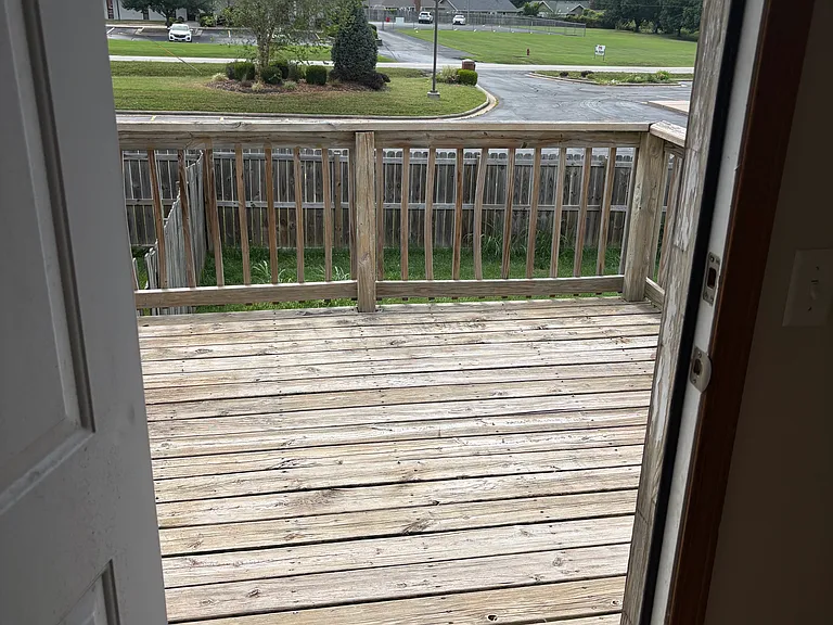 Off back patio deck. No one lives behind unit. Great place for morning coffee